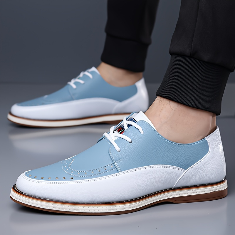 Men's comfortable blue brogue shoes with advanced cushioning & lightweight design for all-day wear.