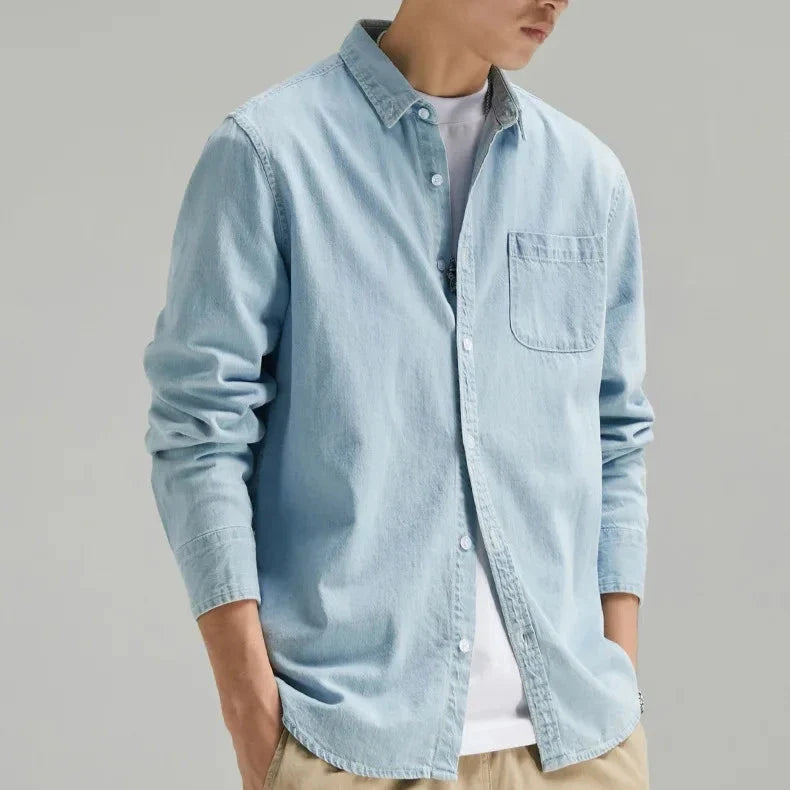 Comfortable men's black denim shirt. Classic fit, long sleeve button-up for effortless casual style.