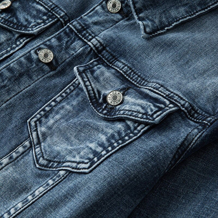 Men's rugged blue denim jacket with classic fit and metal buttons, perfect casual outerwear.