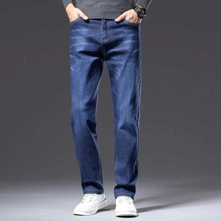 Men's classic blue stretch denim jeans, comfort fit, wrinkle resistant cotton blend for casual wear.