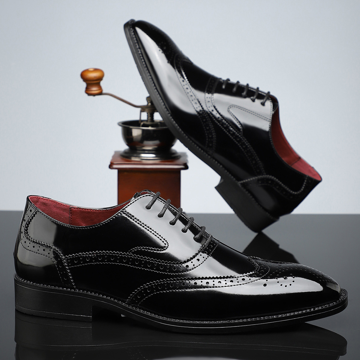 Polished men's dress shoes, classic brogue wingtip, sophisticated for formal attire and office elegance & comfort.