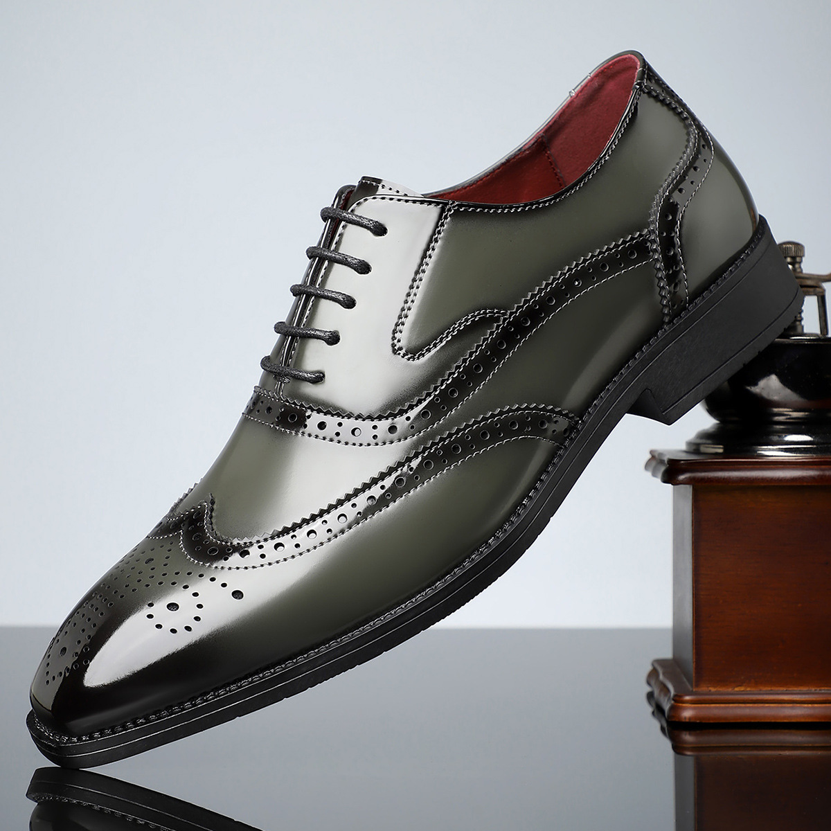 Front view of men's classic brogue dress shoes, elegant wingtip, ideal for formal and office settings, great comfort.