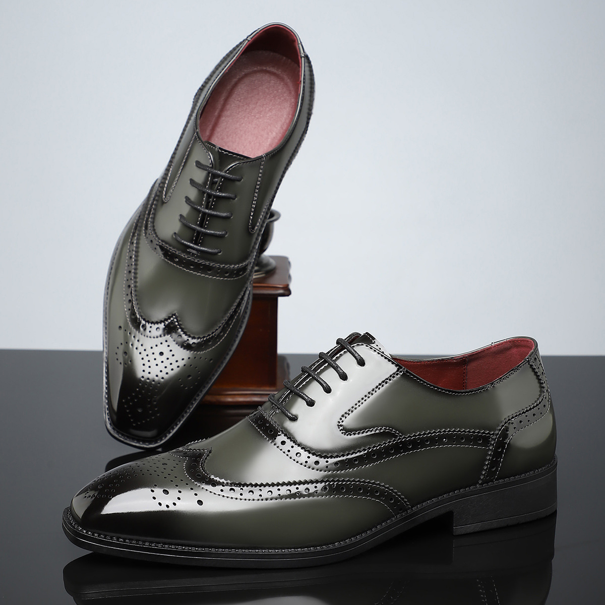 High-angle shot of men's classic brogue dress shoes, polished finish, elegant wingtip detail & comfort.