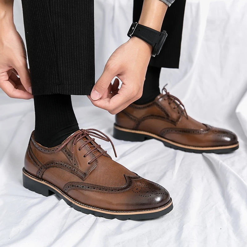 Polished dark brown men's leather brogues, sophisticated classic dress shoes for formal or business events.