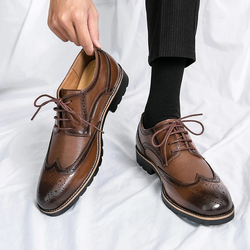 Close-up of men's genuine leather brogue dress shoes, intricate detailing, durable and comfortable formal footwear.