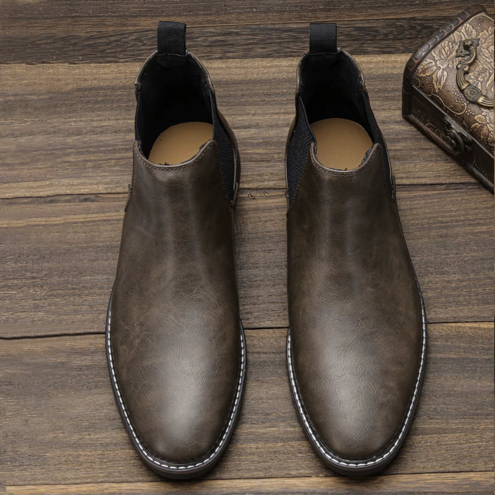 Close-up on the elastic gusset of comfortable men's Chelsea boots, ensuring a secure fit.