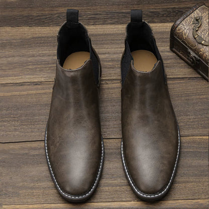 Close-up on the elastic gusset of comfortable men's Chelsea boots, ensuring a secure fit.