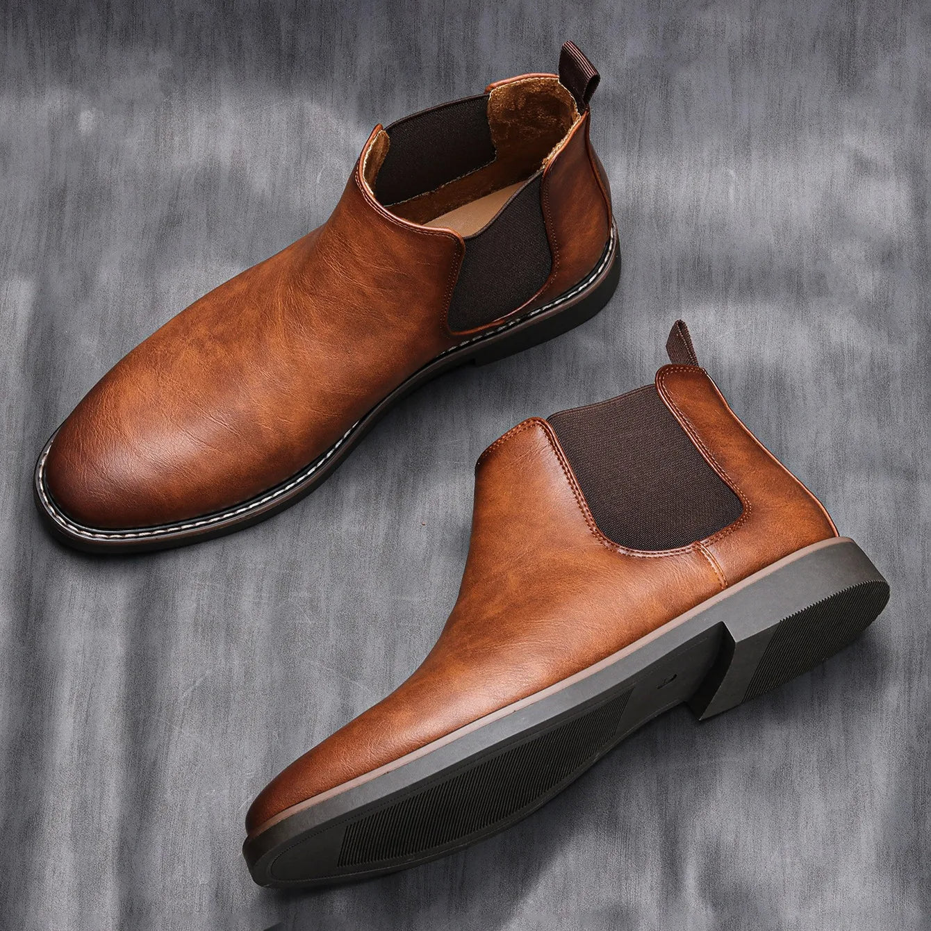 Side view of a comfortable men's ankle Chelsea boot, highlighting its timeless design.