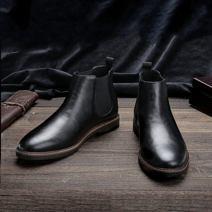 Men's stylish Chelsea boots paired with denim jeans, showcasing a perfect casual look.