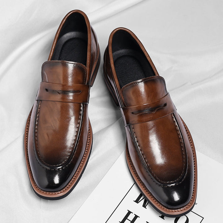 Detailed shot of premium leather men's penny loafers, showcasing classic style & comfortable slip-on design.