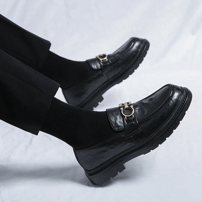 Black suede men's slip-on loafers, versatile for casual or dressy occasions.