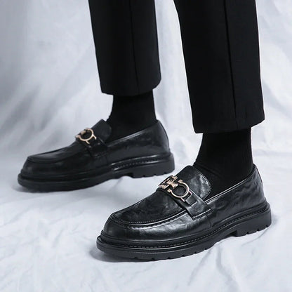 Sleek black men's slip-on loafers, designed for both comfort and formal elegance.