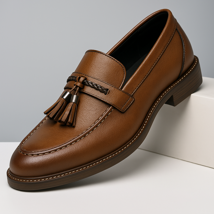 Men's classic brown leather tassel loafers, perfect for a polished, formal look.