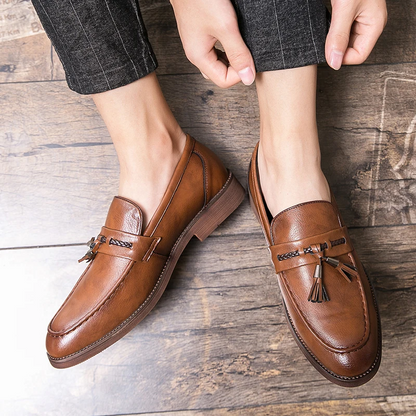 Men's sophisticated brown tassel loafers, ideal dress shoes for a refined appearance.
