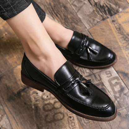 Classic men's brown leather tassel loafers, sophisticated slip-on footwear for a polished finish.