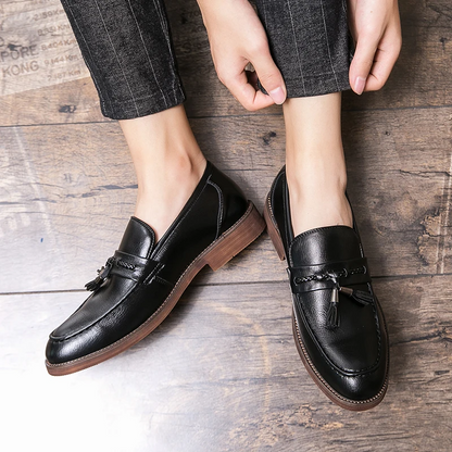 Stylish men's brown slip-on tassel loafers, essential classic footwear for effortless style.