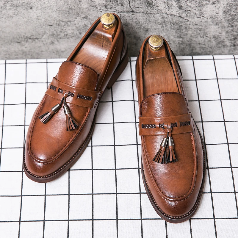 Stylish men's tassel loafers in rich brown, ideal for both formal and casual fashion.