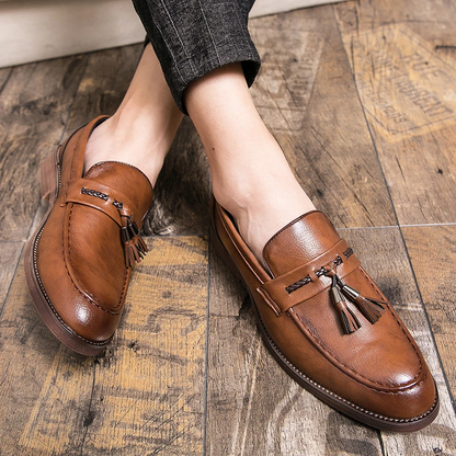 Comfortable brown men's loafers with tassels, perfect slip-on footwear for any occasion.