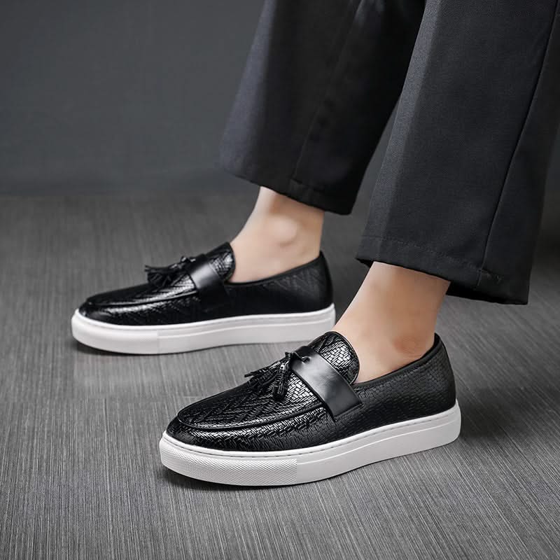 Black leather tassel loafers for men. Classic slip-on dress shoes, essential for men's fashion & comfort.