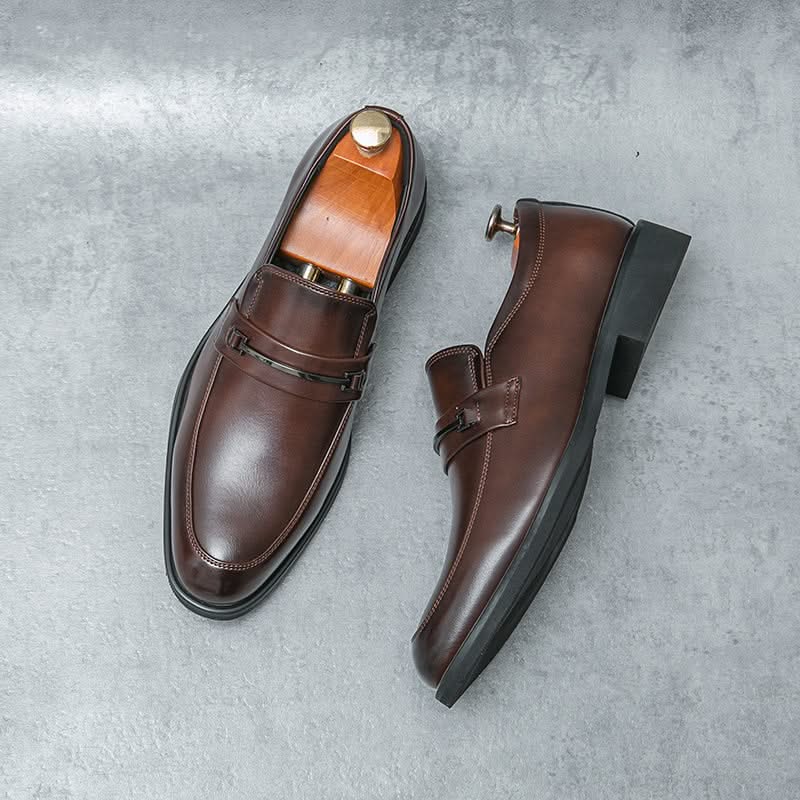 Stylish black men's slip-on loafers, ideal for both formal dress shoes and casual everyday outfits.