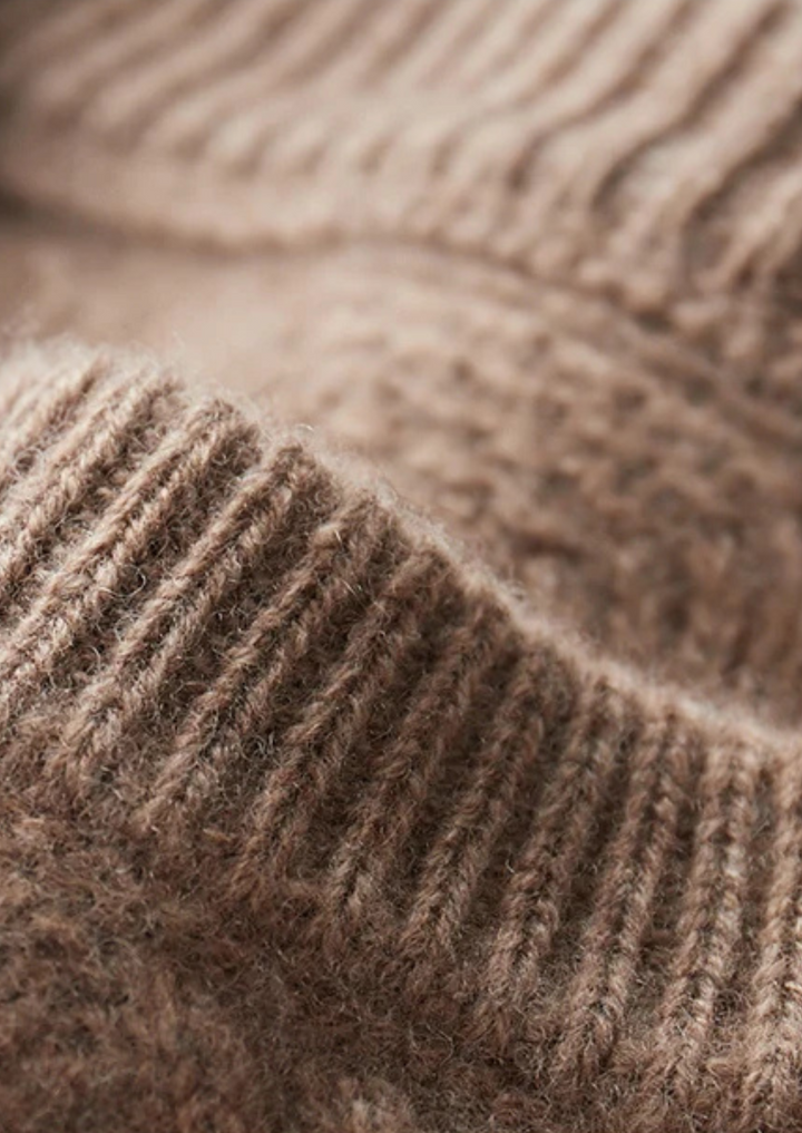 Warm men's cable knit crew neck sweater. Classic, cozy, and stylish winter knitwear.