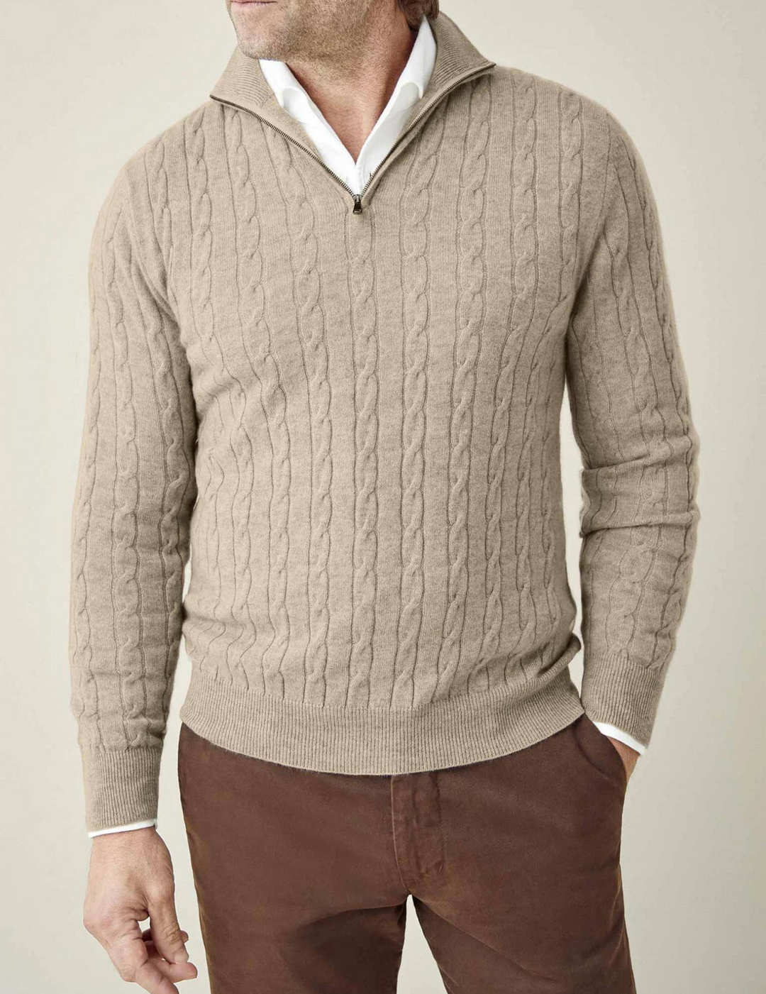 Men's warm cable-knit quarter-zip sweater, excellent for layering over shirts in winter fashion.