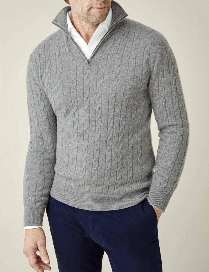 Classic men's cable-knit quarter-zip sweater, an essential piece of winter knitwear for men.