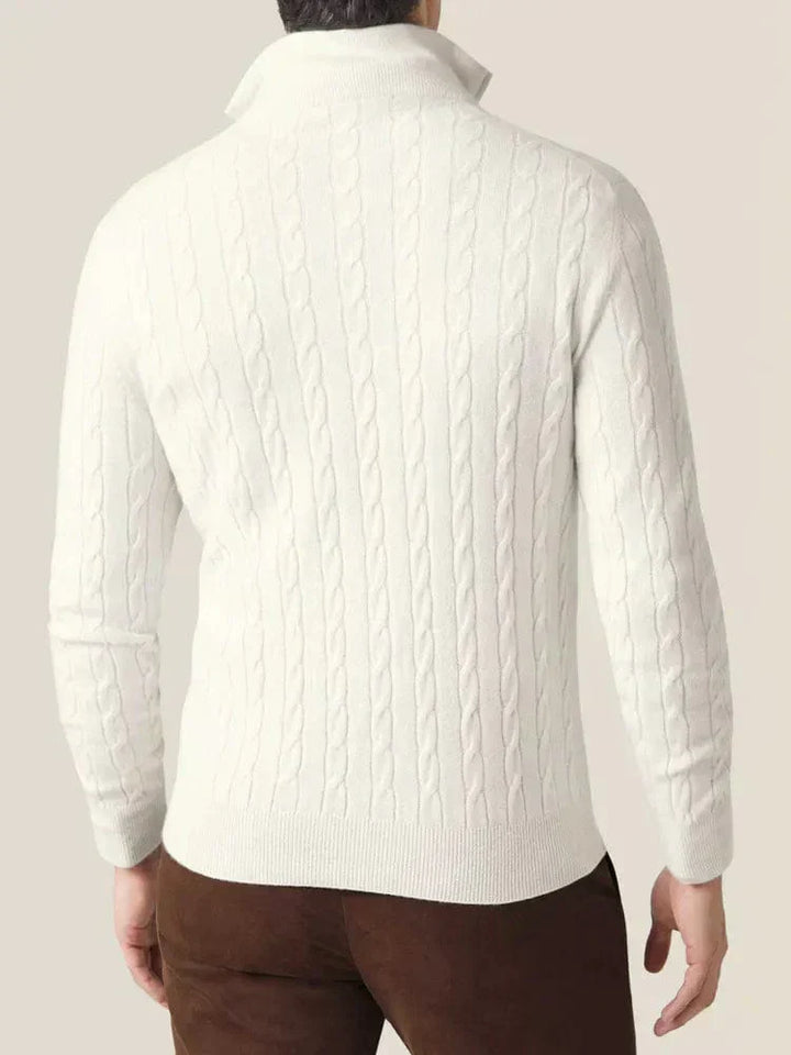 Man wearing a stylish cable-knit quarter-zip sweater, showcasing its casual elegance and fit.