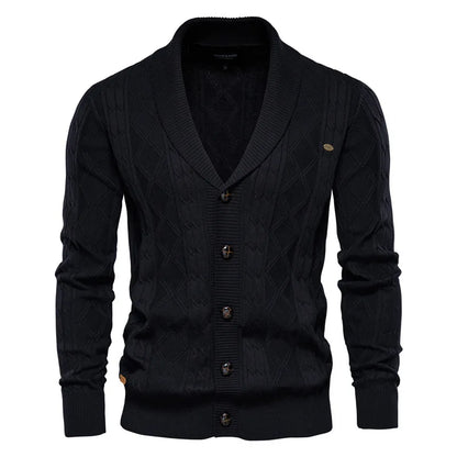 Detailed view of a men's elegant cable-knit shawl collar sweater, showcasing the rich texture and classic design.