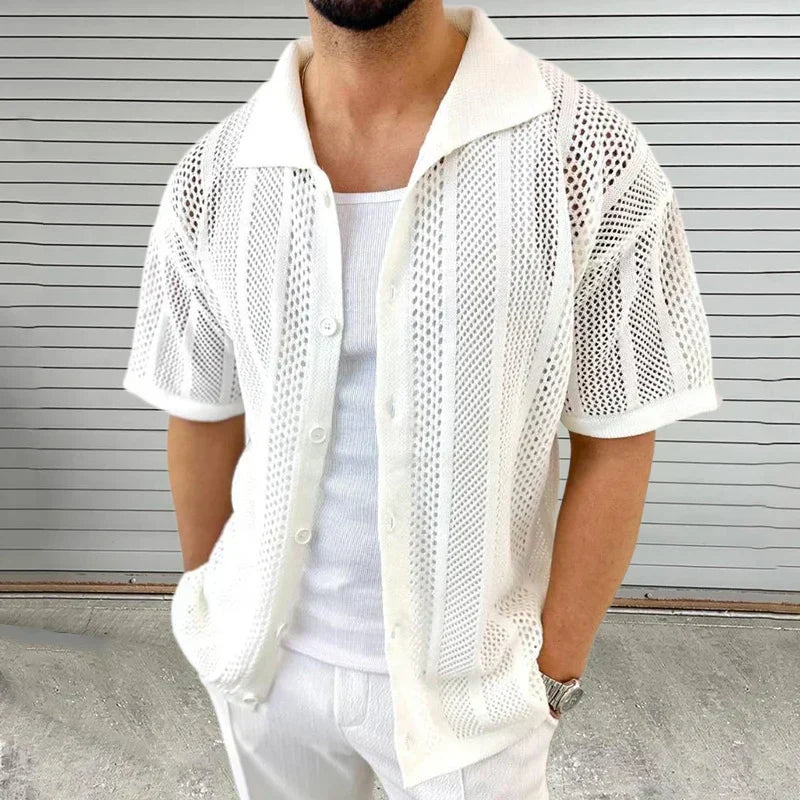 Close-up of men's short sleeve knit shirt featuring a classic collar. Ideal for smart casual comfort.