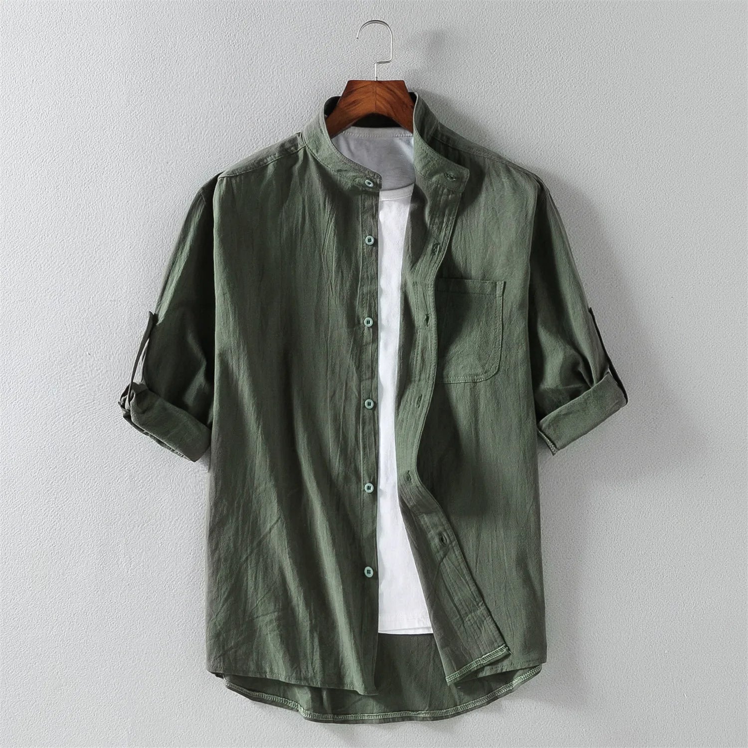 Close-up of comfortable, breathable cotton fabric on men's long sleeve button-up shirt, perfect for casual fashion.