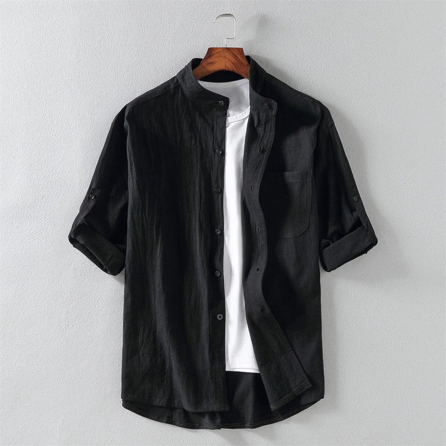 Man wearing a relaxed fit men's cotton button-up shirt, styled for comfortable and breathable everyday wear.