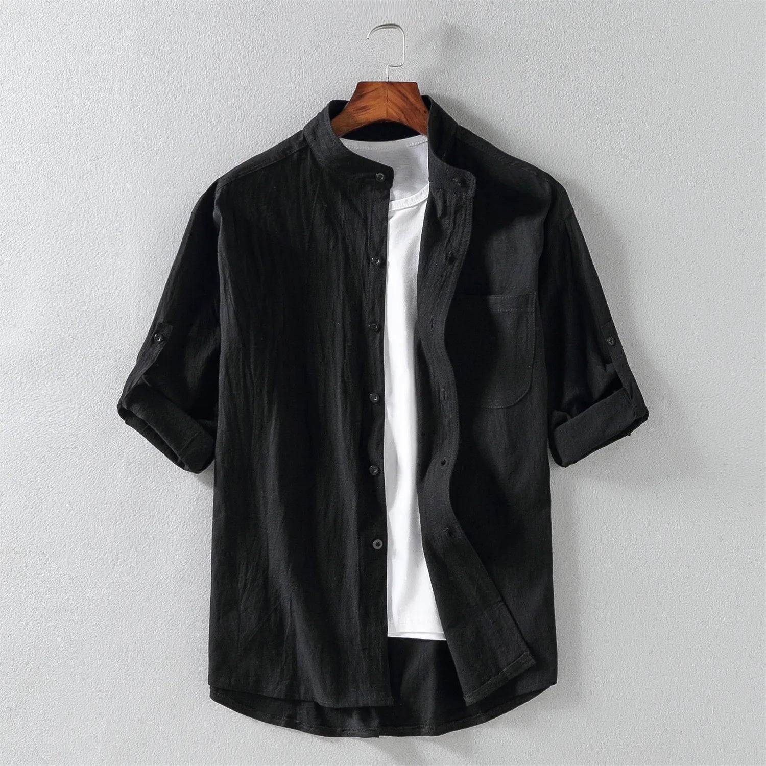 Man wearing a relaxed fit men's cotton button-up shirt, styled for comfortable and breathable everyday wear.