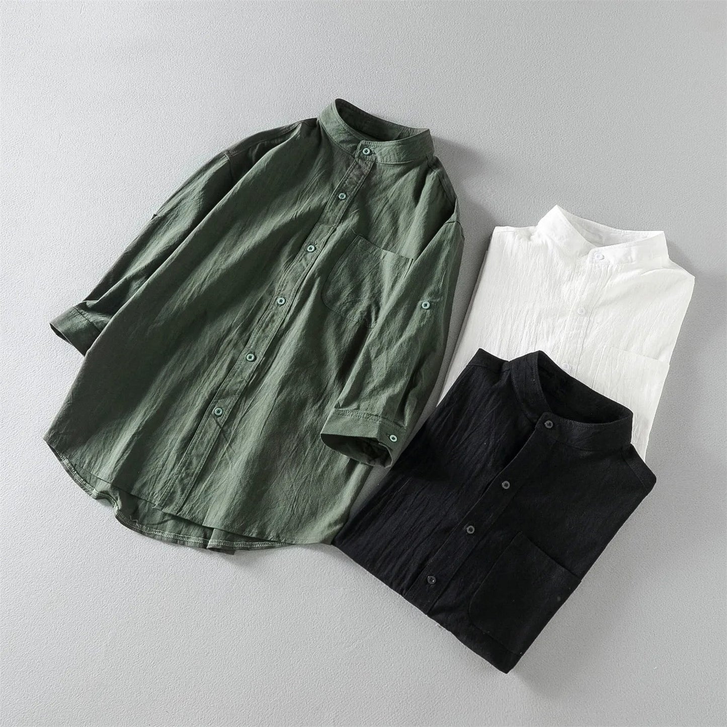 Neatly folded men's breathable cotton button-up shirt, a versatile long sleeve for casual and comfortable fashion.