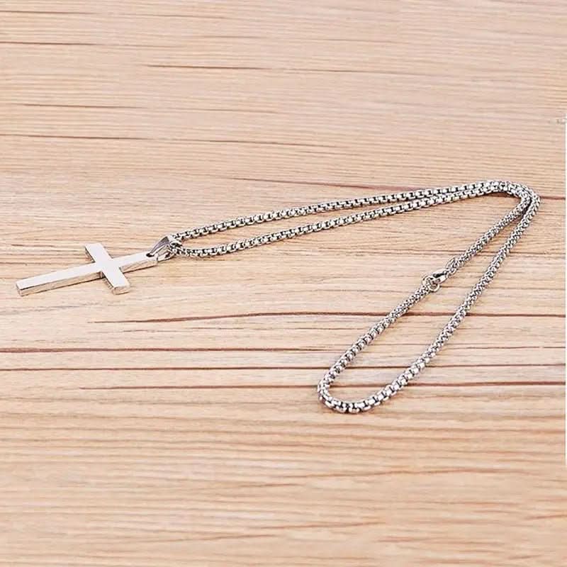 Silver-tone men's cross pendant necklace, a versatile religious jewelry piece enhancing men's fashion with classic style.