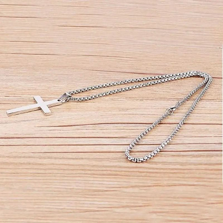 Silver-tone men's cross pendant necklace, a versatile religious jewelry piece enhancing men's fashion with classic style.
