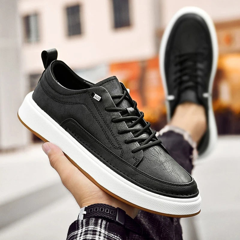 Everyday black cowhide men's sneakers, ideal walking shoes for comfort & style.