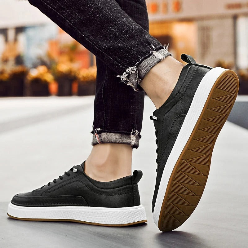 Black leather men's walking sneakers, comfortable cowhide shoes for all-day wear.