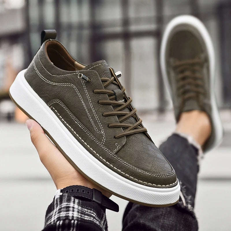 Stylish dark brown men's sneakers, cowhide leather for all-day comfort & urban look.