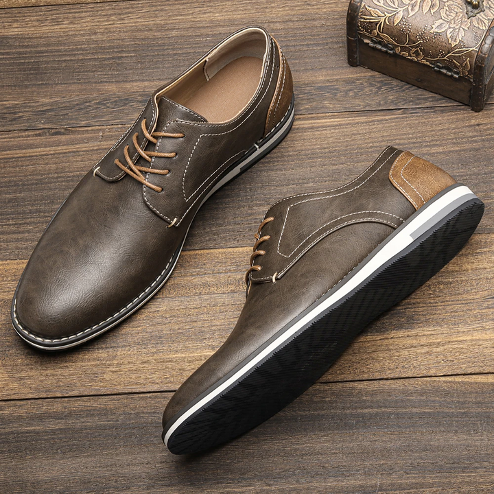 Sleek black leather men's derby shoes, ideal for elegant style & comfortable formal business wear.