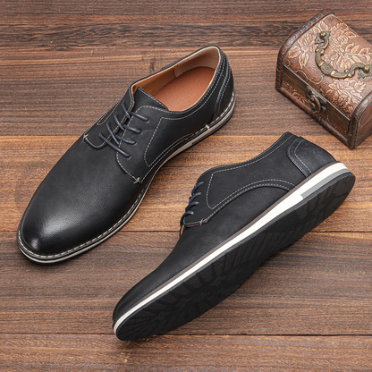 Side view of classic black leather men's derby dress shoes, featuring elegant design for business attire.