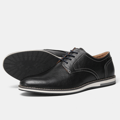 Men's classic black leather derby dress shoes, styled for a sharp, professional and elegant men's fashion look.
