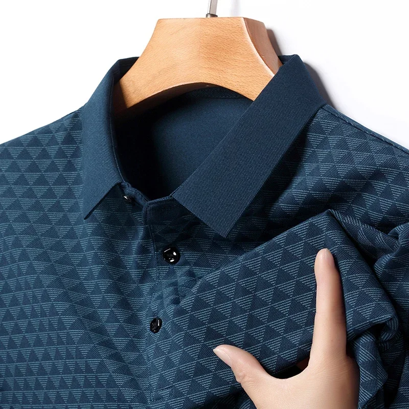 Close-up of a men's diamond pattern classic polo shirt, showcasing refined texture & short sleeve design.
