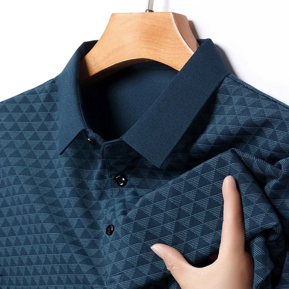 Close-up of a men's diamond pattern classic polo shirt, showcasing refined texture & short sleeve design.