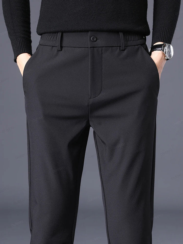 Gray men's classic fit dress pants, tailored with elastic waist for ultimate comfort and versatile styling.