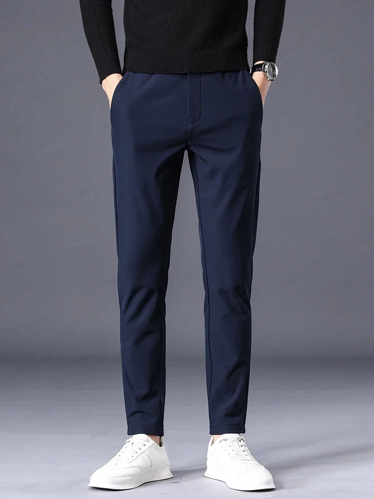 Tailored black men's classic fit dress pants, comfortable elastic waist, perfect for a smart yet relaxed look.