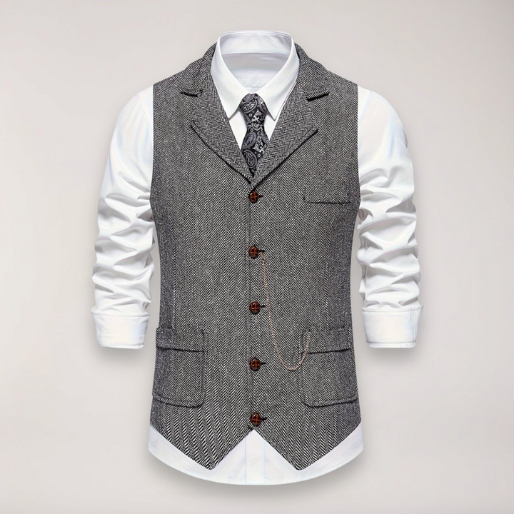 Men's formal herringbone waistcoat in a classic fit, paired with a shirt, enhancing a sophisticated smart casual ensemble.