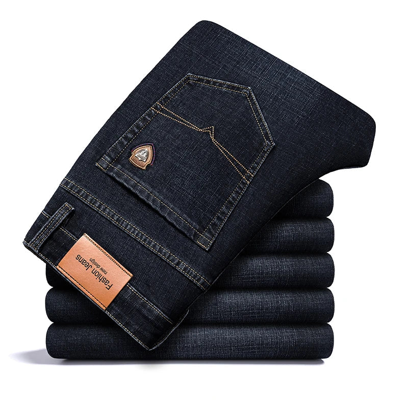Close-up of texture on men's classic stretch denim jeans, showing durable fabric quality.