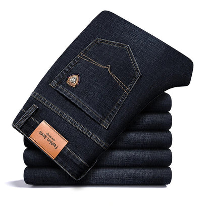 Close-up of texture on men's classic stretch denim jeans, showing durable fabric quality.