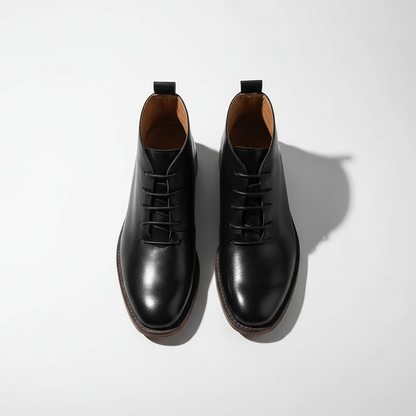 Black men's classic full-grain leather boots, side profile showing Goodyear welt & timeless design.